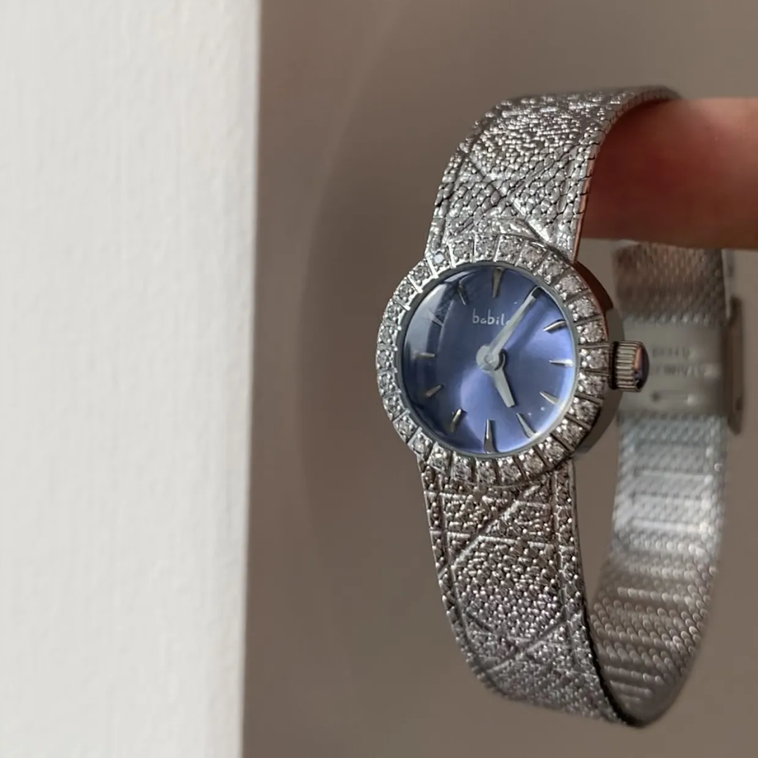 Lustrous Silver Elegance: Blue Dial Mesh Timepiece