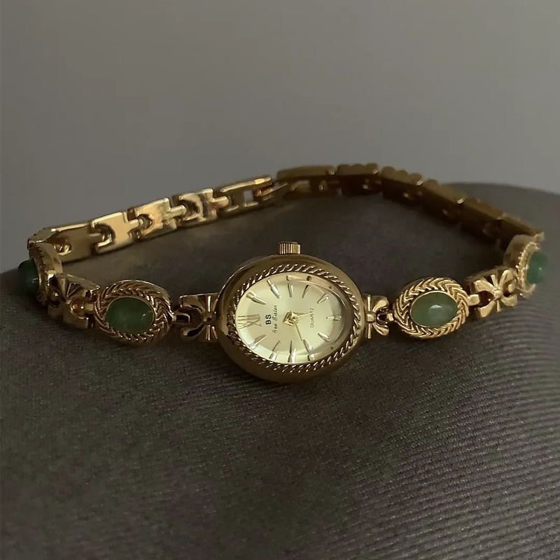 Emerald Glow Timepiece: Gold and Green Elegance Watch