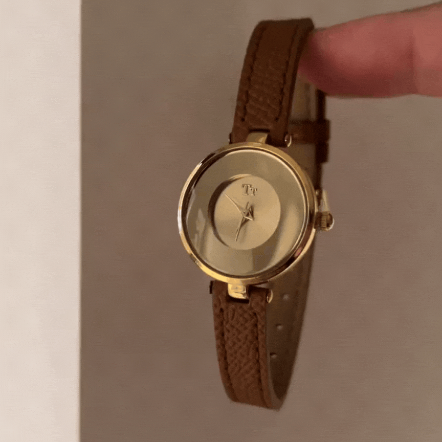 Amber Glow Timepiece: Brown Leather & Glass Dial Watch