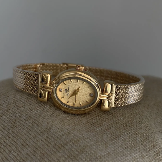 Golden Sheaf Timepiece: Oval Quartz Watch