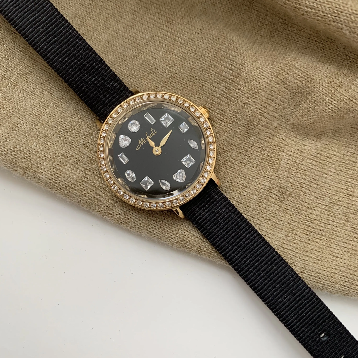 Radiant Noir Timepiece: Gold and Black Diamond-Accented Watch